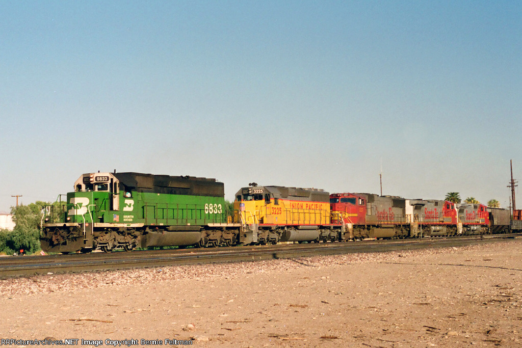 Burlington Northern SD40-2 #6833 leads a westbound past the depot 